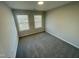 Bedroom featuring neutral walls, carpet floors, two windows with blinds allowing natural light in at 1202 Alston Landing Way # 06, Cary, NC 27519