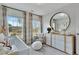 Bedroom boasts natural light, decorative accents, and a large round mirror at 1202 Alston Landing Way # 06, Cary, NC 27519