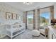 Bedroom with neutral safari wallpaper, soft lighting, and a cozy seating area at 1202 Alston Landing Way # 06, Cary, NC 27519
