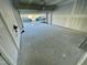 Spacious two-car garage featuring an open garage door at 1202 Alston Landing Way # 06, Cary, NC 27519