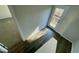 Hallway featuring wood floors, neutral walls, and natural light coming from the door to outside at 1202 Alston Landing Way # 06, Cary, NC 27519