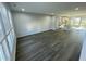 Open-concept living area flowing into the modern kitchen with hardwood floors at 1202 Alston Landing Way # 06, Cary, NC 27519