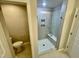 Modern bathroom with tile shower, glass doors, and toilet at 1206 Alston Landing Way # 08, Cary, NC 27519