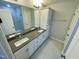Bathroom with double sinks, granite countertops, and a glass-enclosed shower at 1206 Alston Landing Way # 08, Cary, NC 27519