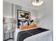 Comfortable bedroom featuring stylish decor, including a modern light fixture and attractive wall art at 1206 Alston Landing Way # 08, Cary, NC 27519