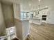 Elegant kitchen featuring white cabinets, stainless steel appliances, pendant lights, and an open-concept layout at 1206 Alston Landing Way # 08, Cary, NC 27519