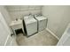 Bright laundry room with tile flooring, utility sink, washer and dryer at 1206 Alston Landing Way # 08, Cary, NC 27519