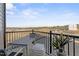 Relaxing balcony area with outdoor seating and an open view of the surrounding landscape at 1234 Coach Station Alley # 201, Raleigh, NC 27601