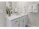 Well-lit bathroom featuring a white vanity, stylish fixtures, and modern decor at 1234 Coach Station Alley # 201, Raleigh, NC 27601