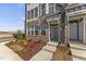 Charming brick townhouse with well-maintained landscaping and inviting front entrance at 1234 Coach Station Alley # 201, Raleigh, NC 27601