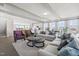Spacious living room with neutral decor, fireplace, and an open view into the kitchen at 1234 Coach Station Alley # 201, Raleigh, NC 27601