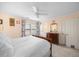 Cozy bedroom with a dresser, carpet, a ceiling fan, and a double door closet at 1303 Dylan Heath Ct, Raleigh, NC 27608