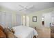Cozy bedroom featuring neutral paint, a ceiling fan, and a double door closet at 1303 Dylan Heath Ct, Raleigh, NC 27608
