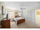 Comfortable bedroom with plush carpet, a ceiling fan, and a spacious closet for ample storage at 1303 Dylan Heath Ct, Raleigh, NC 27608
