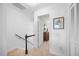 Well-lit hallway features carpet, a decorative painting, and a storage space at 1303 Dylan Heath Ct, Raleigh, NC 27608