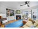 Comfortable living room with fireplace, built-ins, and hardwood floors at 1303 Dylan Heath Ct, Raleigh, NC 27608