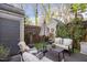 Outdoor patio featuring comfortable seating, a small table, and decorative lighting at 1303 Dylan Heath Ct, Raleigh, NC 27608