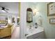 Stylish powder room with patterned wallpaper and modern fixtures at 1303 Dylan Heath Ct, Raleigh, NC 27608