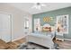Inviting bedroom with warm tones, two windows, and a ceiling fan at 138 Sherwood Ln, Sanford, NC 27332
