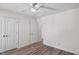 Bedroom with wood-look floors, white trim and doors leading to other rooms in the home at 138 Sherwood Ln, Sanford, NC 27332