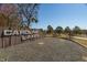 An inviting community entrance welcomes you to Carolina Lakes, featuring attractive landscaping and a prominent sign at 138 Sherwood Ln, Sanford, NC 27332