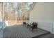 Outdoor deck furnished with seating and wooded views at 138 Sherwood Ln, Sanford, NC 27332