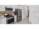 Modern kitchen with stainless steel appliances and white cabinetry at 138 Sherwood Ln, Sanford, NC 27332