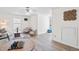 Open living room with wood-look floors, white trim, and modern furniture at 138 Sherwood Ln, Sanford, NC 27332