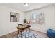 Office features a window with natural light, wood-look floors and mid-century modern furniture at 138 Sherwood Ln, Sanford, NC 27332