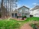 Backyard featuring a screened porch and seating area, perfect for enjoying the outdoors in a peaceful setting at 1428 Heritage Links Dr, Wake Forest, NC 27587