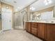Bathroom featuring a glass shower, double vanity sinks, and tile flooring at 1428 Heritage Links Dr, Wake Forest, NC 27587