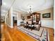 Formal dining room with hardwood floors, classic wainscoting, elegant lighting, and beautiful decor at 1428 Heritage Links Dr, Wake Forest, NC 27587
