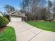 Beautiful home featuring a stone and siding exterior, manicured lawn, and a spacious two-car garage at 1428 Heritage Links Dr, Wake Forest, NC 27587