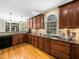 Spacious kitchen featuring granite countertops, wood cabinets, and ample counter space at 1428 Heritage Links Dr, Wake Forest, NC 27587