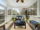 Cozy sunroom with ample windows, comfortable seating, and a tranquil view of the outdoor surroundings at 1428 Heritage Links Dr, Wake Forest, NC 27587