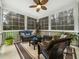 Cozy screened-in porch with comfortable seating and plenty of natural light at 1428 Heritage Links Dr, Wake Forest, NC 27587