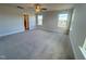 Large bedroom with gray carpet, neutral walls, and plentiful natural light at 145 Bering Cir, Angier, NC 27501