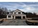 New construction home featuring an unfinished exterior with a covered front porch at 145 Bering Cir, Angier, NC 27501