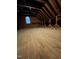Unfinished attic space with wooden flooring and sloped ceiling, offering potential for extra storage at 1703 St. Mary'S St, Raleigh, NC 27608