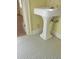 Bathroom with white pedestal sink and blue and white tile floor at 1703 St. Mary'S St, Raleigh, NC 27608
