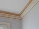 Close-up of a ceiling with decorative crown molding, adding elegance and detail to the room at 1703 St. Mary'S St, Raleigh, NC 27608