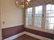Dining room featuring hardwood floors, large windows, and chandelier at 1703 St. Mary'S St, Raleigh, NC 27608