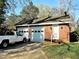 Detached two car garage and a white pickup truck at 1703 St. Mary'S St, Raleigh, NC 27608