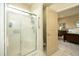 Bathroom with glass shower, accessible design, and adjacent access to the main bedroom at 1914 Tweed Ln, Burlington, NC 27215