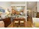 Open dining area with hardwood floors, seamlessly connected to the kitchen, ideal for Gathering meals and entertaining at 1914 Tweed Ln, Burlington, NC 27215
