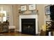 Elegant fireplace with white mantel, providing a focal point and adding warmth to the cozy living space at 1914 Tweed Ln, Burlington, NC 27215