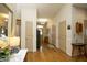 Spacious entry hall featuring hardwood flooring, high ceilings, and ample natural light creating an inviting ambiance at 1914 Tweed Ln, Burlington, NC 27215