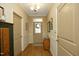Inviting foyer featuring hardwood floors, neutral walls, and decorative lighting, creating a warm and elegant entrance at 1914 Tweed Ln, Burlington, NC 27215