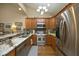 Modern kitchen with stainless steel appliances, granite countertops, and custom cabinetry, perfect for cooking and entertaining at 1914 Tweed Ln, Burlington, NC 27215