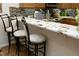 Kitchen breakfast bar with granite countertops and seating, ideal for casual dining and entertaining at 1914 Tweed Ln, Burlington, NC 27215